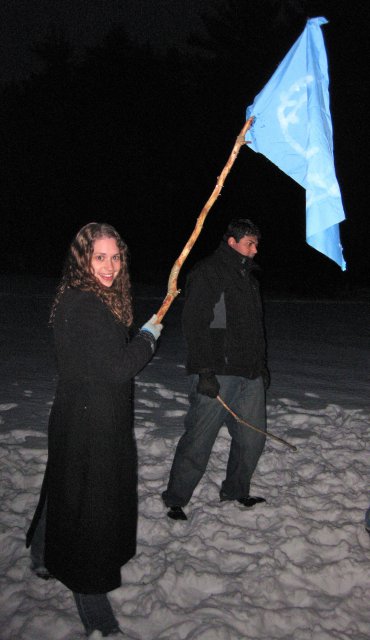 Stephanie Lowers Her Flag Into the Flames